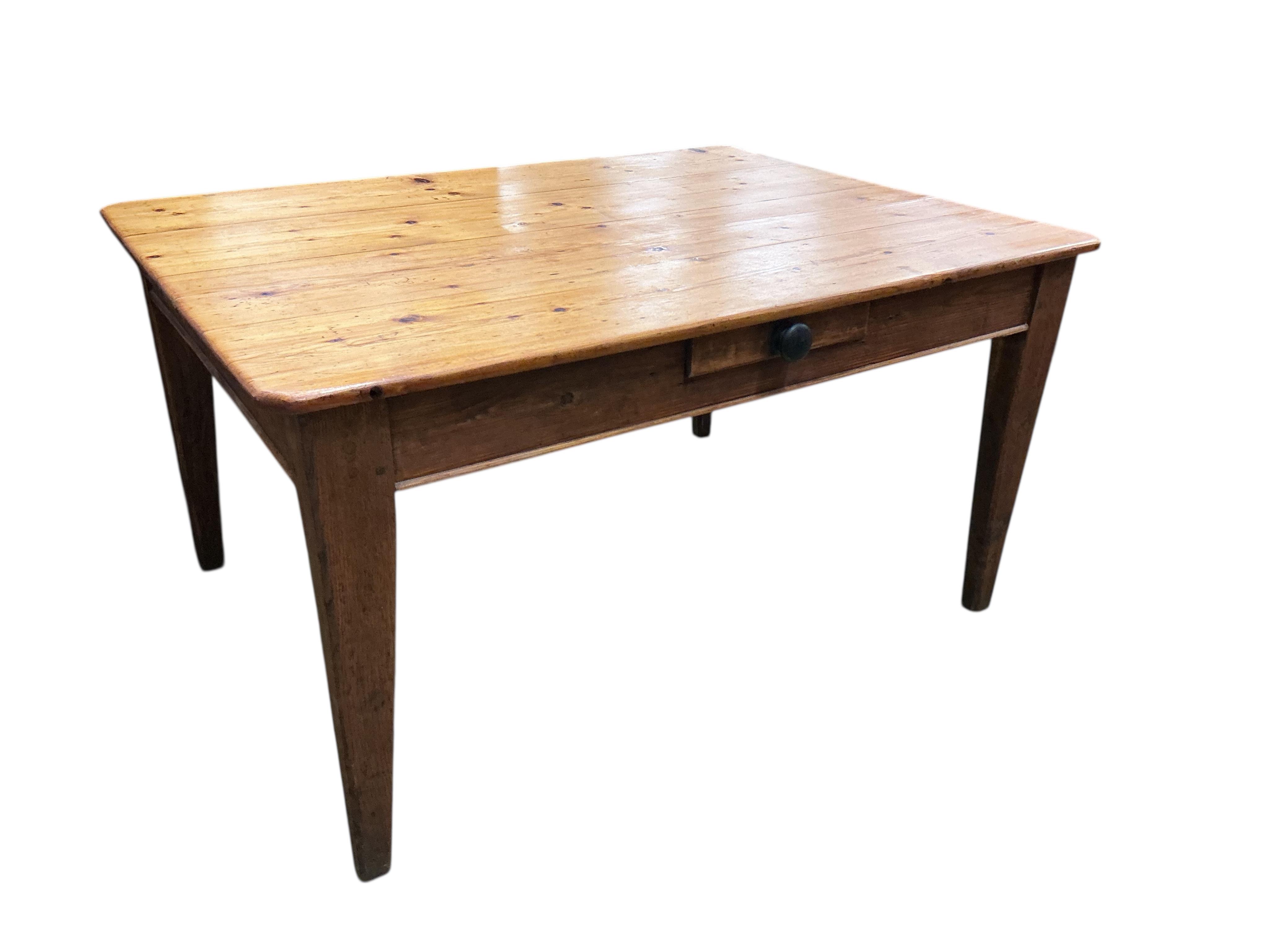 A mid 19th century rectangular pine kitchen table, fitted drawer on square tapered legs, width 136cm, depth 104cm, height 72cm
